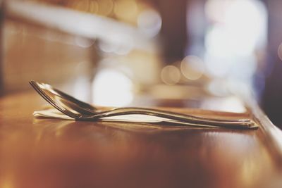 Close-up of wine glasses on table