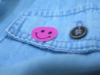 Close-up of button on jeans