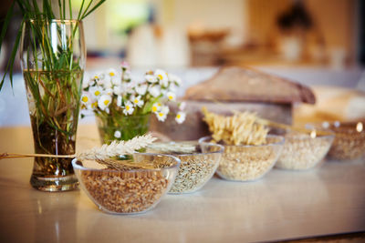 Various grains in bowls on table