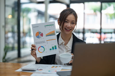 Businesswoman working at desk in office