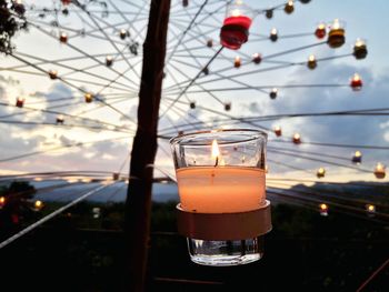 Close-up of wine in glass against sky