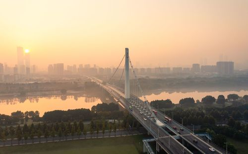 High angle view of city at sunset