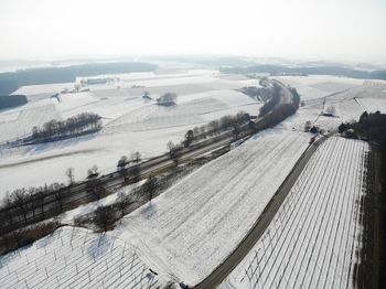 Aerial view of landscape against sky during winter