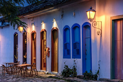 Street and colonial style houses illuminate at night in the city of paraty