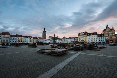 Buildings in city at sunset