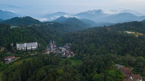 High angle view of townscape and mountains against sky