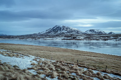 Scenic view of snowcapped mountains against sky