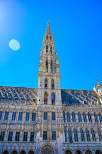 Low angle view of historical building against blue sky