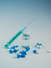  syringe with needle, pills and vial with steroids. illegal doping in sport concept