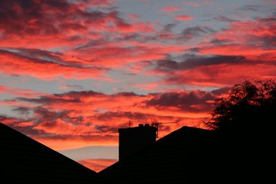 Low angle view of cloudy sky at sunset