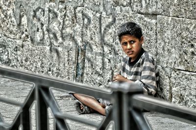 Portrait of young man in city