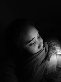 Close-up of woman in darkroom