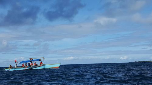 Scenic view of calm sea against cloudy sky