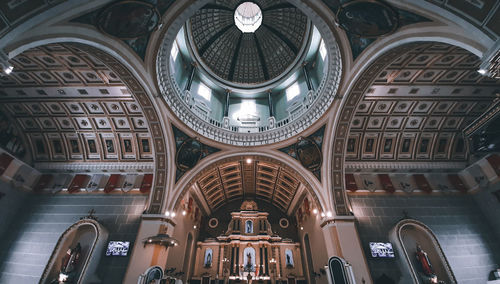 Low angle view of illuminated ceiling of building