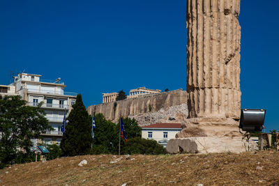 Ruins of the temple of olympian zeus also known as the olympieion and the acropolis in athens 