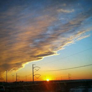 Scenic view of dramatic sky at sunset