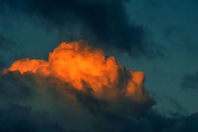 Low angle view of orange clouds against sky at night