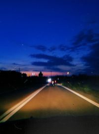 Road against sky at night