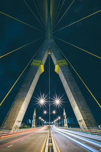 Light trails on road bridge at night