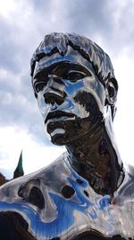 Low angle view of statue against sky