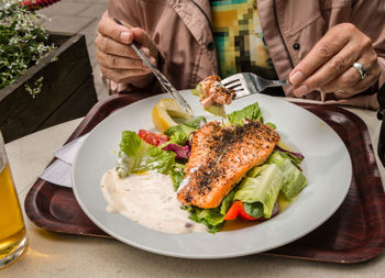 Close-up of woman eating food