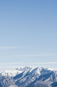 Scenic view of snowcapped mountains against clear sky