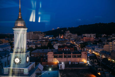 Illuminated buildings in city at night