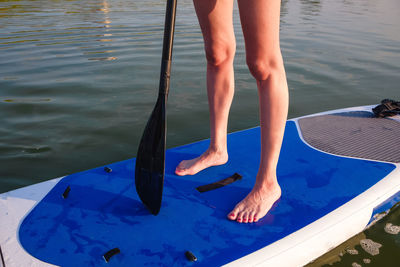 Low section of woman in swimming pool