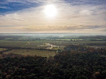 High angle view of field against sky during sunset