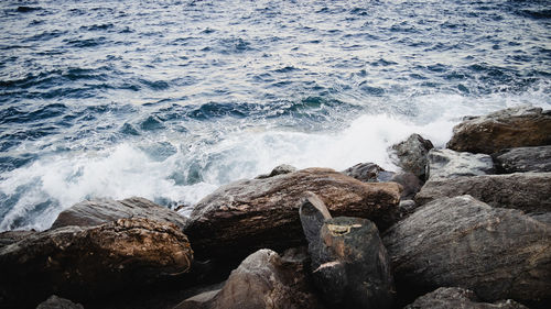 Waves splashing on rocks at shore