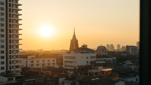 Cityscape against sky during sunset