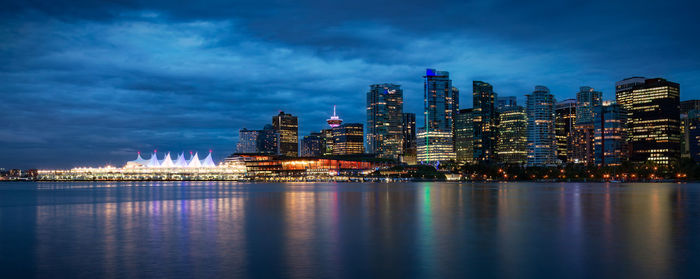 Illuminated city at waterfront