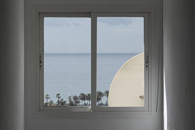 Sea seen through glass window