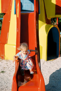 High angle view of boy sitting in car