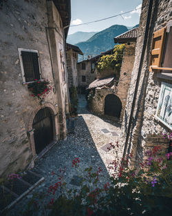 Alley amidst buildings against sky