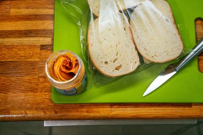 High angle view of sandwich with peanut butter. breakfast on table