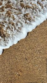 High angle view of surf on beach