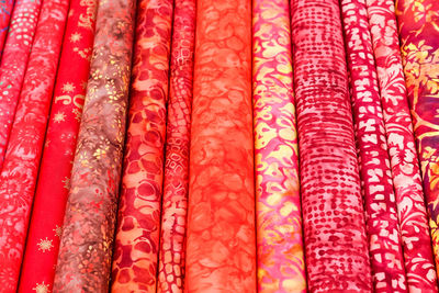 Detailed close up view on samples of cloth and fabrics in different colors found at a fabrics market