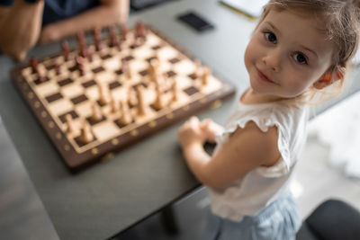 Close-up of boy playing chess