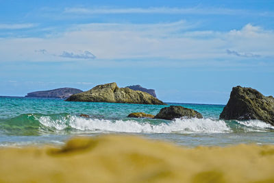 Scenic view of sea against blue sky