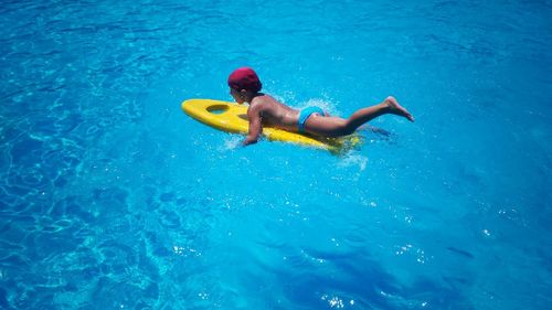 High angle view of man swimming in pool