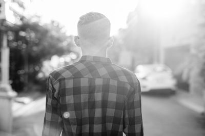 Rear view of man standing on street