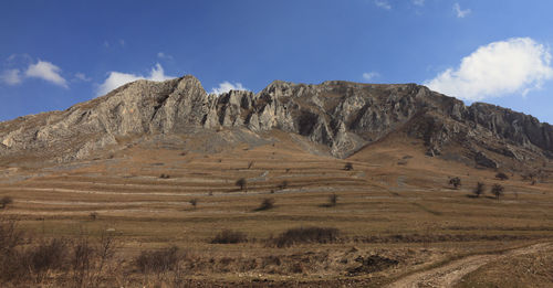 Scenic view of landscape and mountains against sky