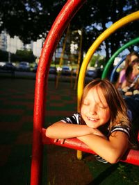 Portrait of happy girl playing in park