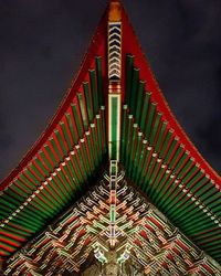 Low angle view of illuminated built structure against sky