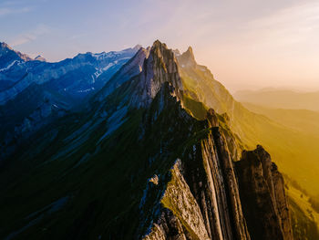 View of rocky mountains against sky