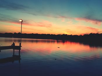 Silhouette of lake at sunset