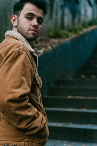 Portrait of young man standing outdoors