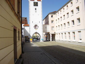 Street amidst buildings against sky