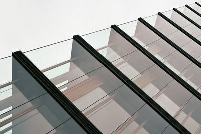 Low angle view of modern building against clear sky